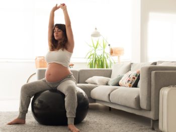 Exercise in pregnancy woman doing exercises with a fitness ball