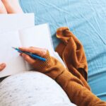 Pregnant woman writing her birth plan