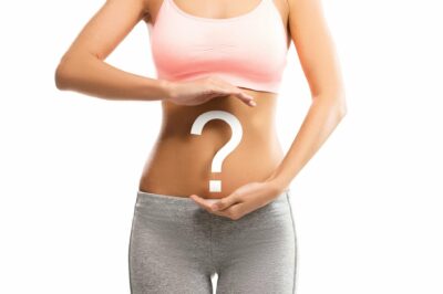 woman with question mark over her abdomen