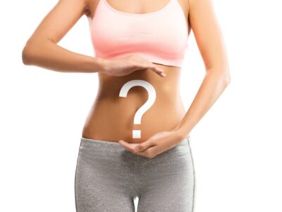 woman with question mark over her abdomen