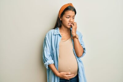 Beautiful-pregnant-hispanic-woman-looking-stressed