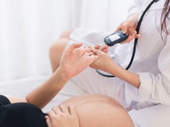 Female Obstetrician doctor checking for Gestational diabetes during pregnancy
