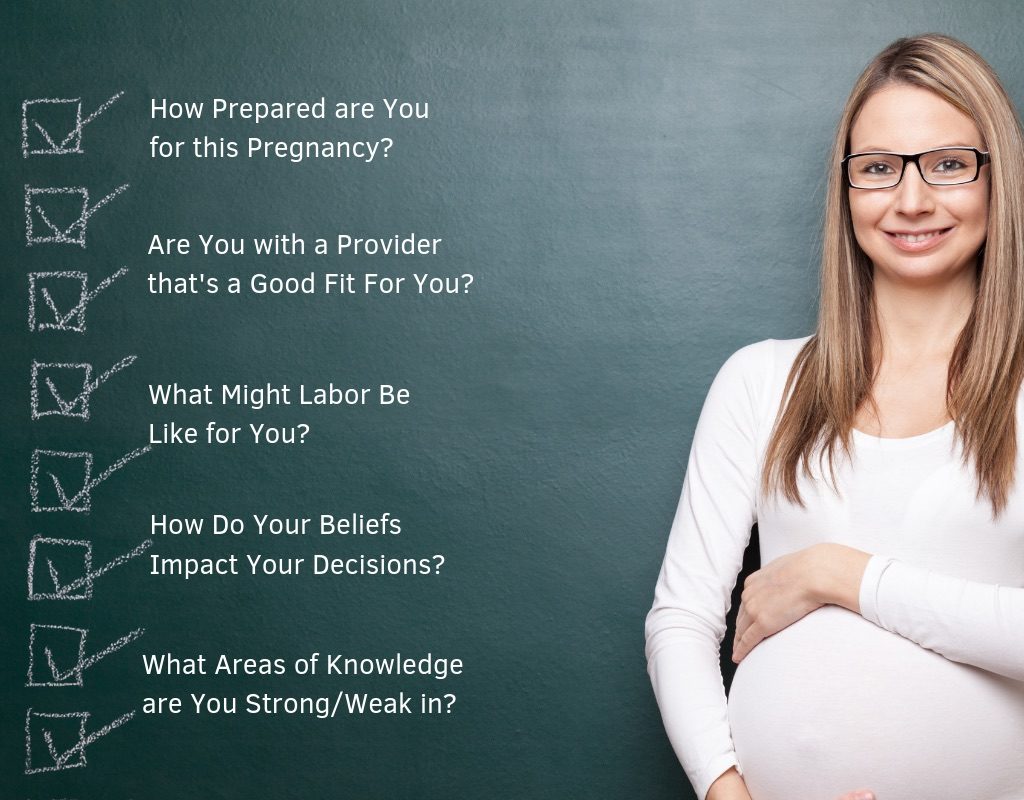 Pregnant-woman-standing-in-front-of-black-board