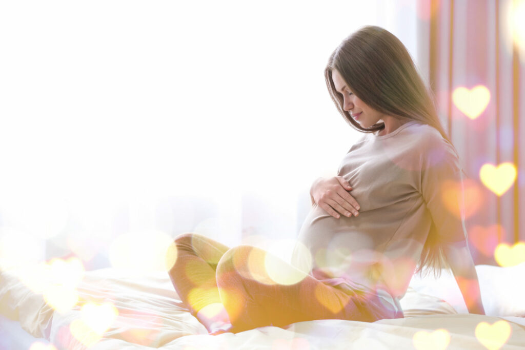 pregnant-woman-sitting-on-bed 