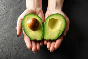 hands-holding-an-avocado