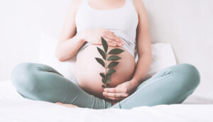 pregnant-woman-holding-leaf