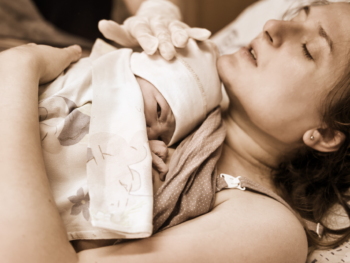 mom-holding-newborn-after-giving-birth-at-home