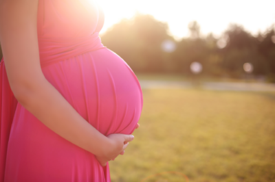 pregnant-belly-bright-pink-dress