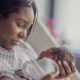 new-mother-holds-her-newborn-baby-oxytocin's-role-in-natural-childbirth